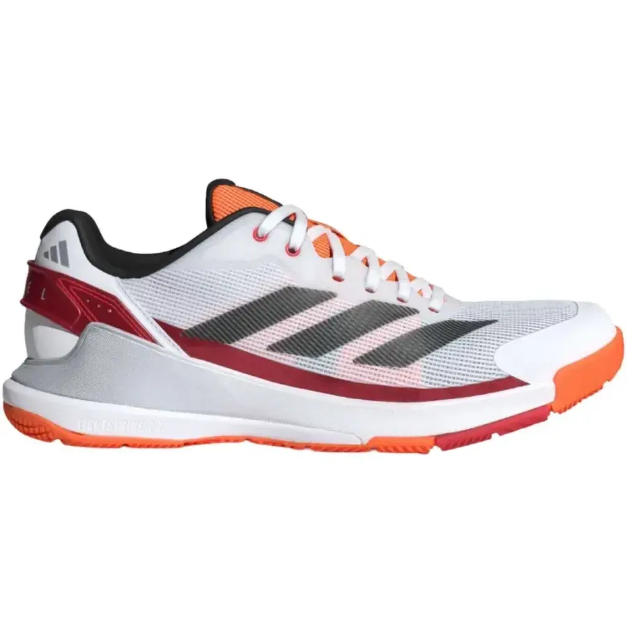 Adidas Crazyquick LS padelsko i vitt med svarta ränder, röd detalj vid hälen och orange yttersula, sedd från sidan